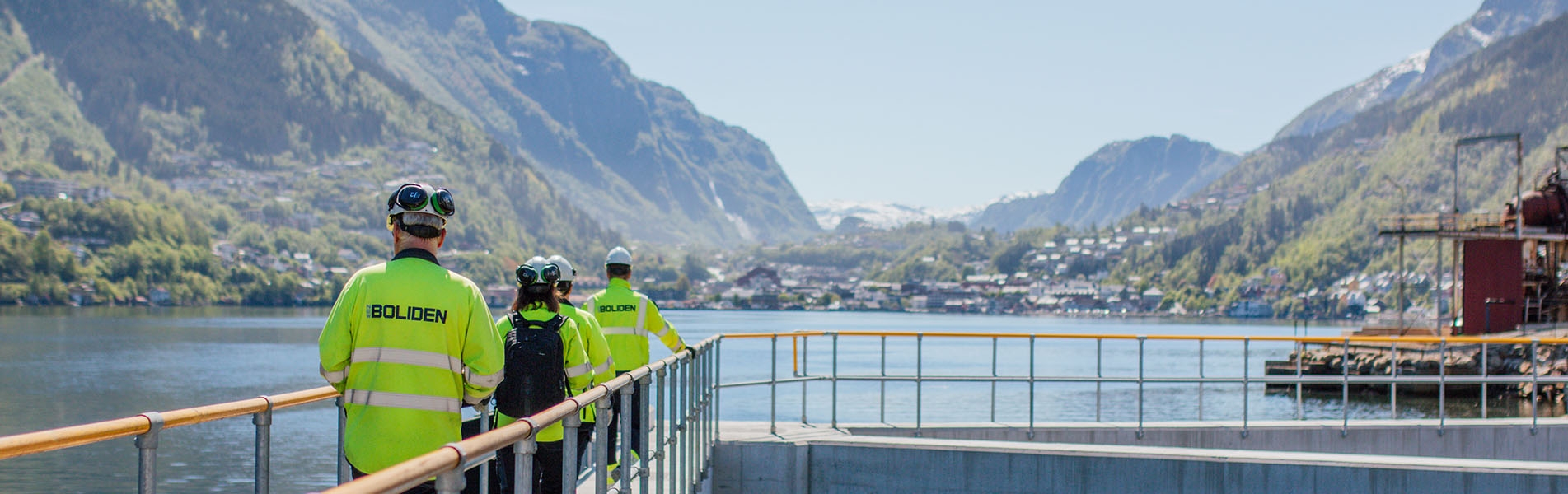 Employees walking on quay in Odda
